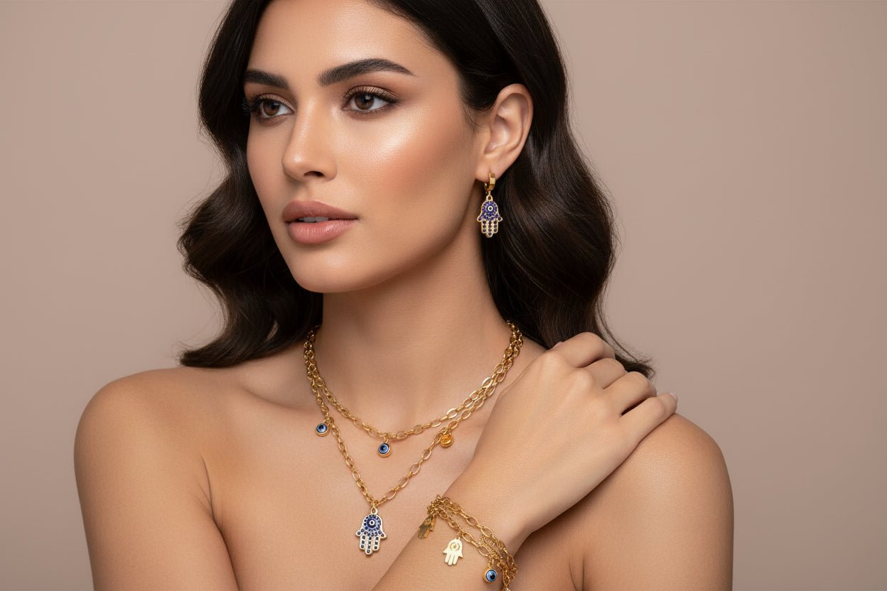 Gold jewelry set with Hamsa hand and evil eye charms 