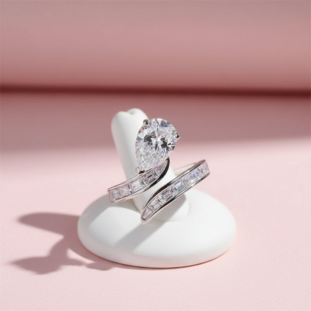 Silver ring with a pear shaped moissanite stone