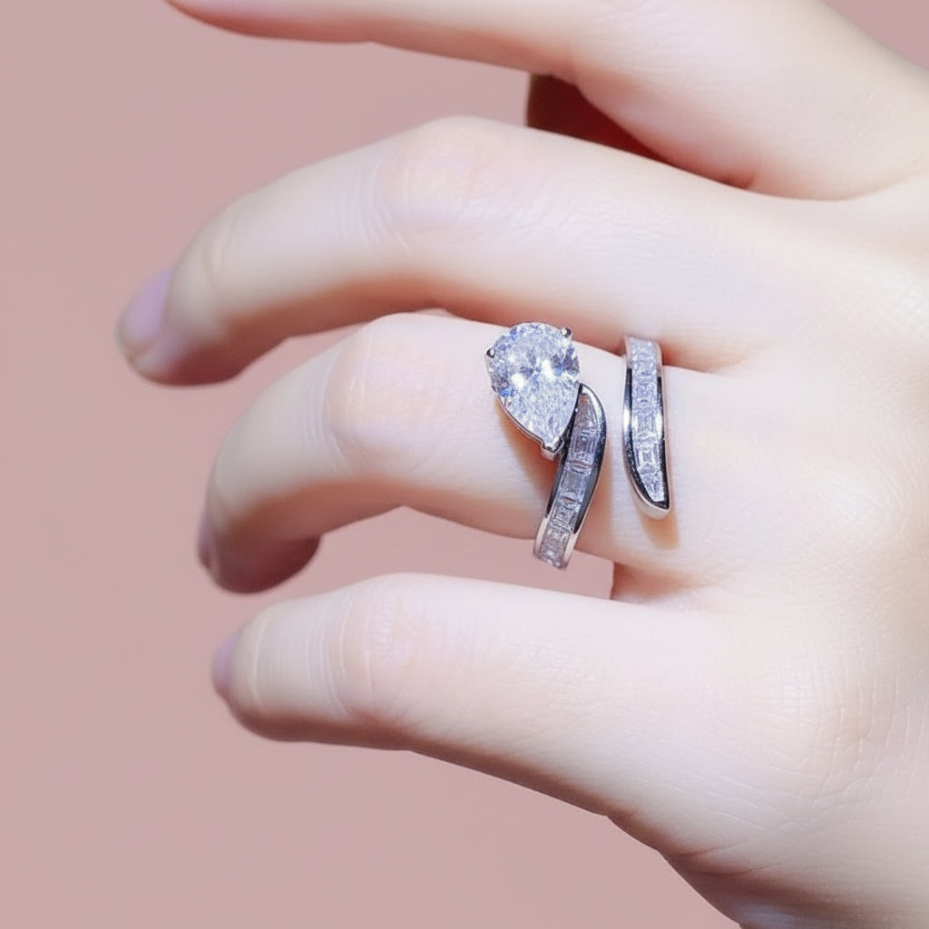 Silver ring with a pear shaped moissanite stone