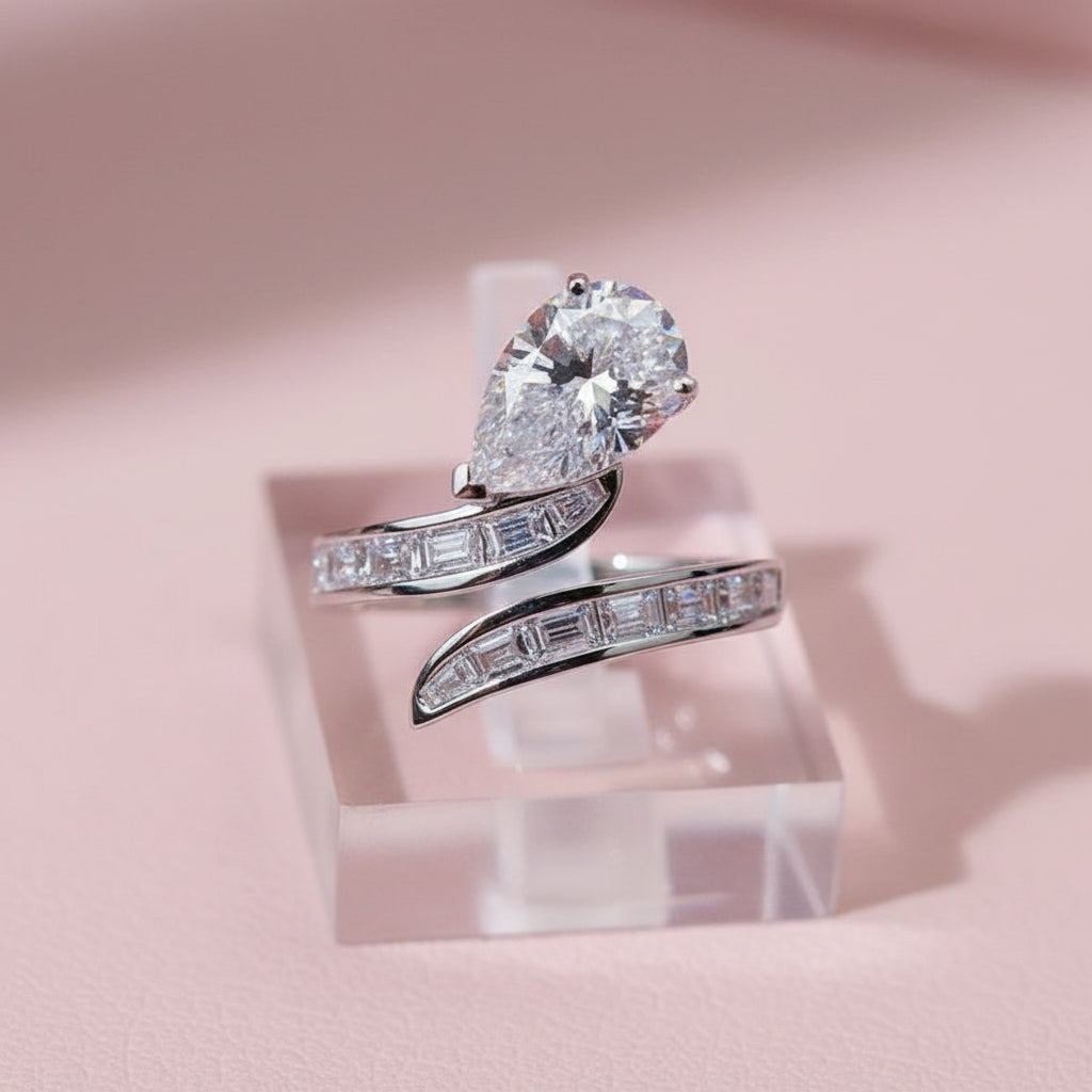 Silver ring with a pear shaped moissanite stone