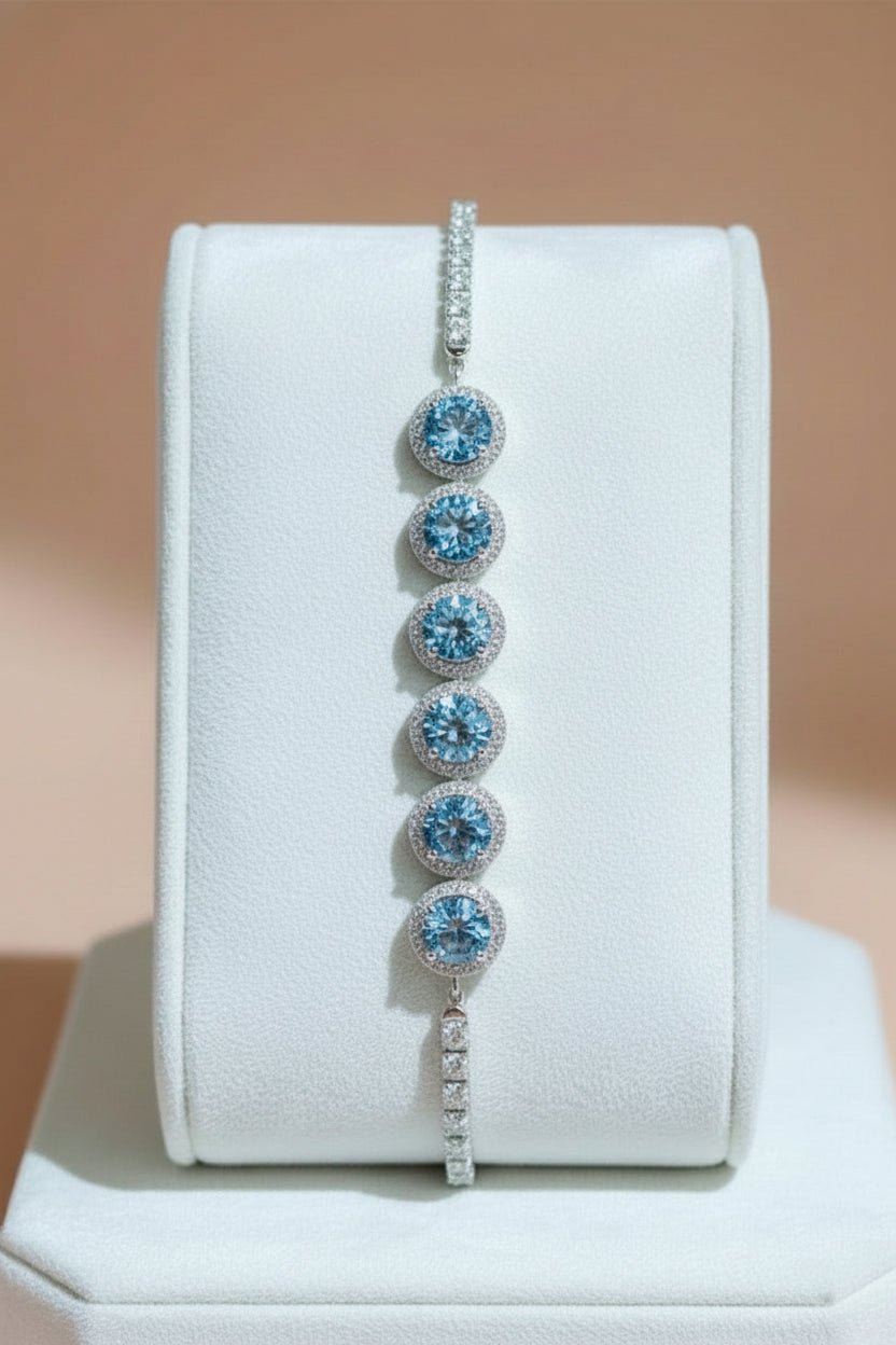 Silver bracelet with blue gemstones and moissanite stones.