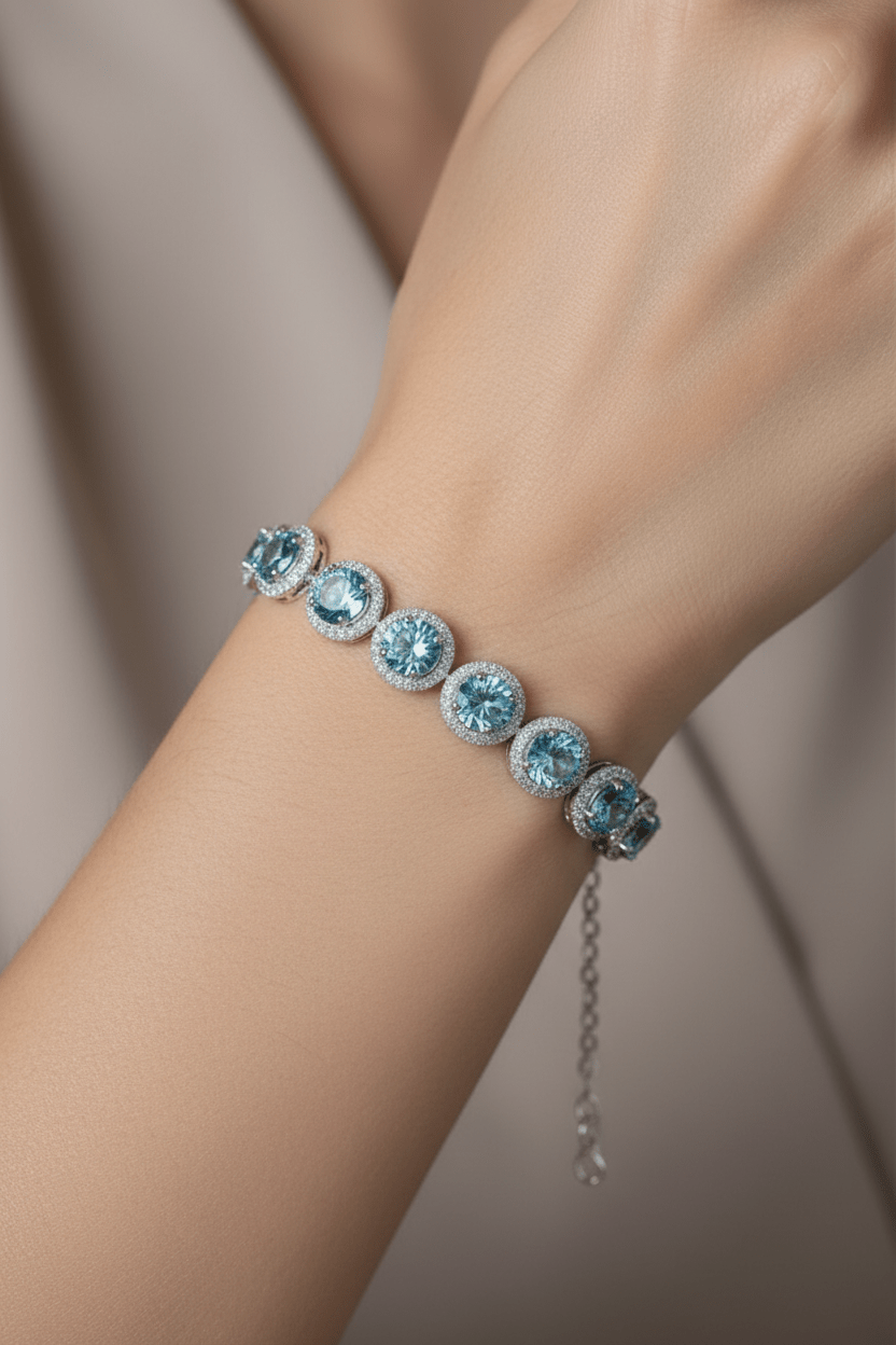 Silver bracelet with blue gemstones and moissanite stones.
