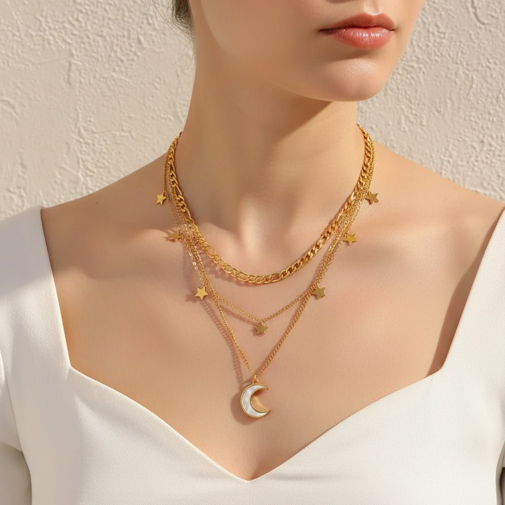 gold necklace with star and moon pendants