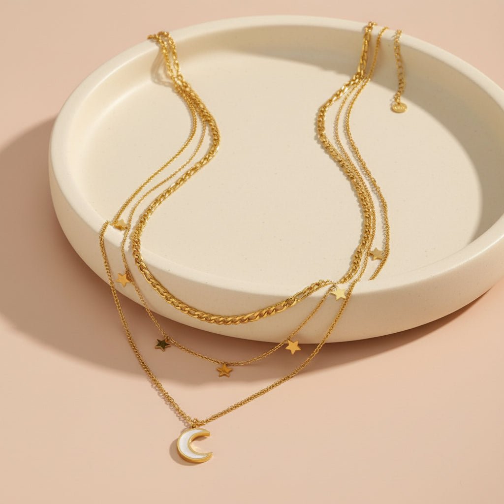 gold necklace with star and moon pendants