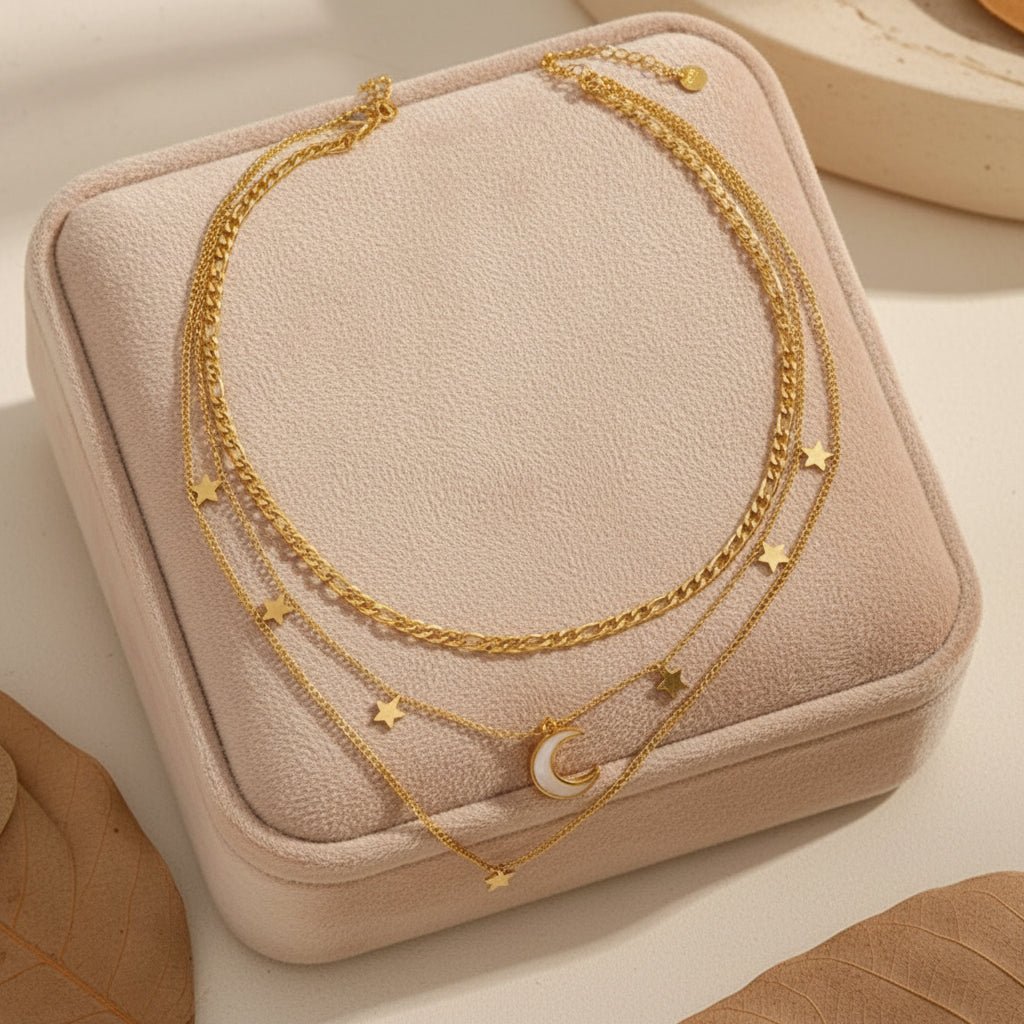 gold necklace with star and moon pendants