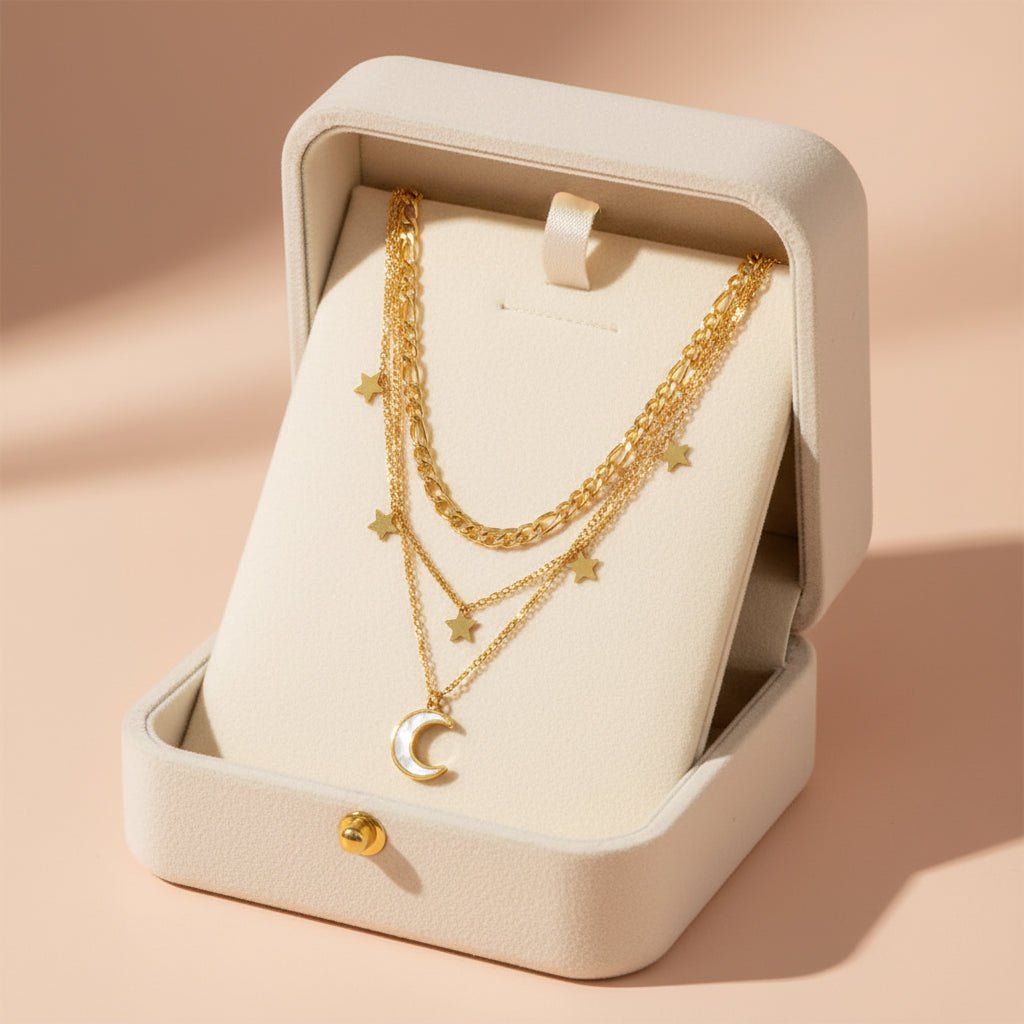 gold necklace with star and moon pendants