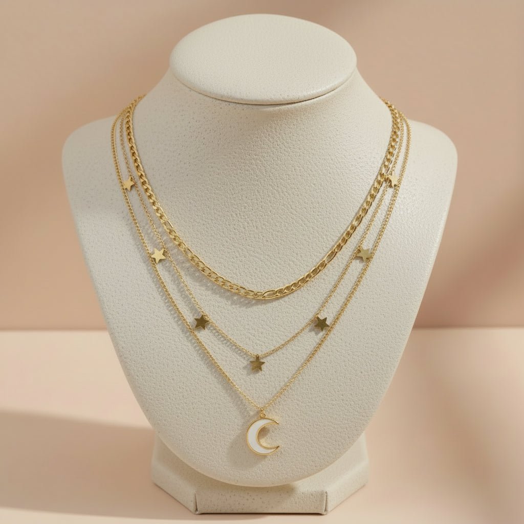 gold necklace with star and moon pendants
