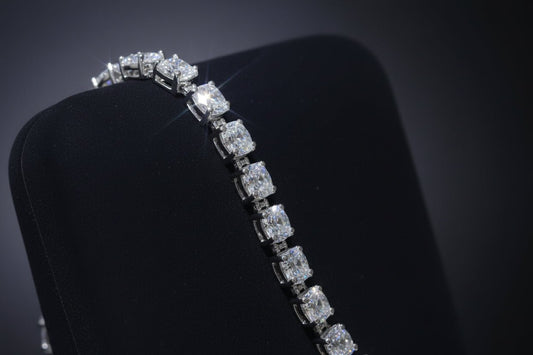 Celeste tennis bracelet placed on a square black suede holder