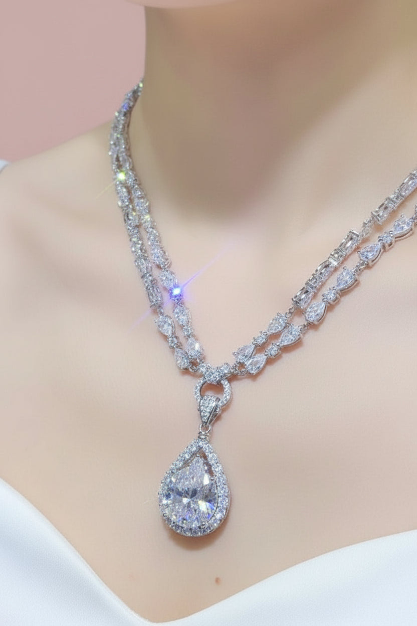 Silver moissanite necklace with a teardrop pendant 