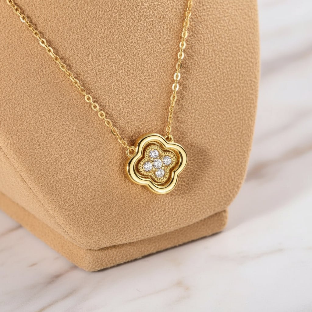 Gold necklace with a clover shaped pendant